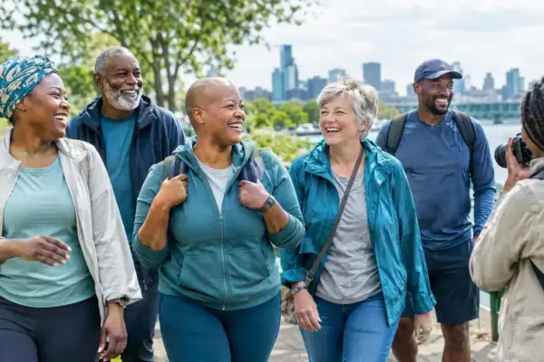 Cancer survivors enjoying an outdoor community experience together, representing life, recovery, connection and meaningful living beyond cancer.